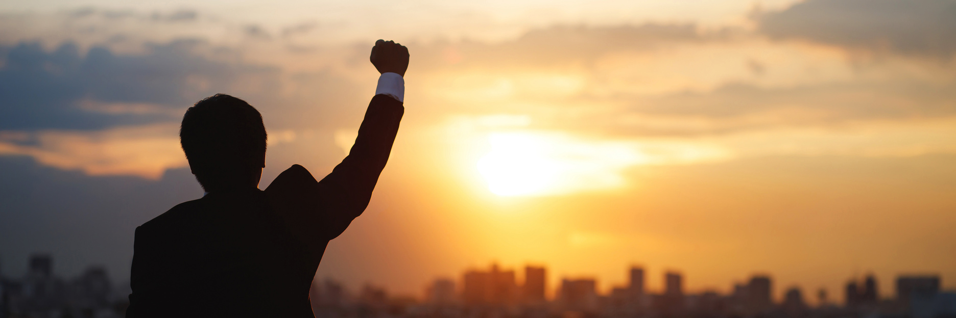 Successful Businessman Raising His Hand     
